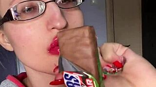 giantess with huge lips n glasses smears snickers bar... mmm so messy!