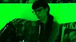 Beth's kinky goth domina smokes seductively in green light!