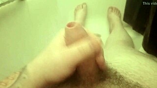 Amateur guy strokes penis in steamy shower solo
