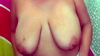 suzie the milf strips slowly to show her huge boobs