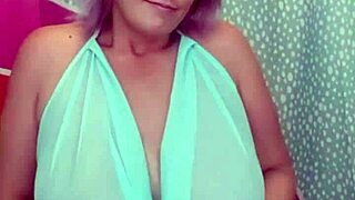 suzie the milf strips slowly to show her huge boobs
