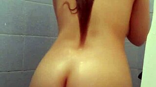 Latina amateur babe lathers up her big tits in shower