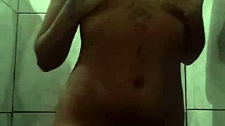 This naughty brunette masturbates in the shower POV