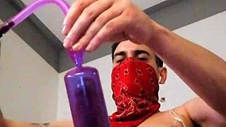 She strokes her big toy alone in stockings with tattoos