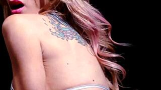 Tattooed Sarah stuffs pussy with red toy