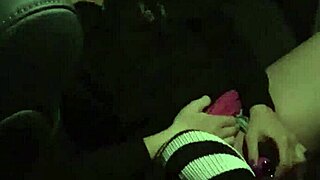 The casual narrative of a woman masturbating in the backseat with a dildo, achieving orgasm outdoors.