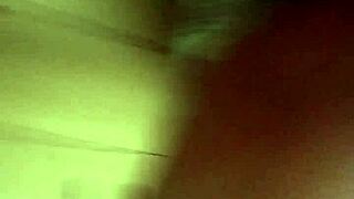 A couple having sex in the dark