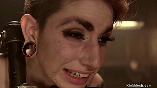 Tattooed redhead tied up, gagged, choked, and whipped hard!