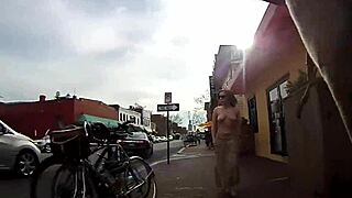 Wow, check this girl walking topless around town!