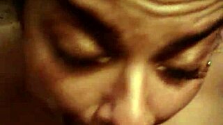 Lusty Latina gives a blowjob to a big black cock
