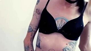 in lingerie, the hot transsexual rubs her clitty while fantasizing about cock and masturbation.