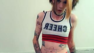 in lingerie, the hot transsexual rubs her clitty while fantasizing about cock and masturbation.