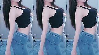 Sexy Asian girl dances with vibrator on camera
