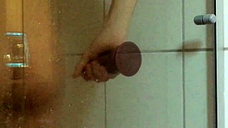 Horny young man pleasures himself with a dildo