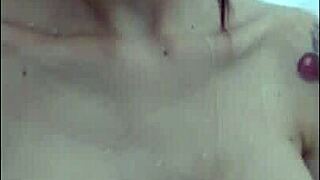 Big-boobed beauty indulges in solo shower play