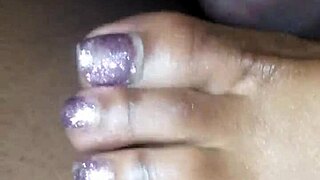 Toes teasing cock in footjob