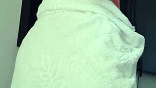 Latina blonde slut flaunts her big ass in a towel at the window 😍