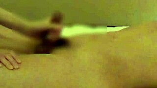 In a cozy bedroom, a beautiful Chinese girlfriend teases with handjob and blowjob. She brings him to climax.