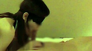 In a cozy bedroom, a beautiful Chinese girlfriend teases with handjob and blowjob. She brings him to climax.