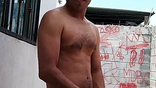 A gay man masturbates on his balcony and ejaculates.