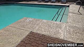 Ebony babe MsNovember strips off her swimsuit after pool time. She bares her petite ass close up in the bathroom.