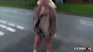 British blonde flashes perky assets in public with daring outdoor pissing