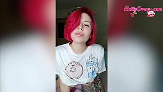 Red-haired girl with tattoo plays with toys in a homemade setting