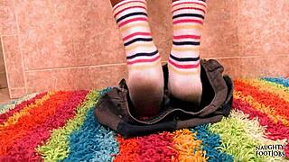 Keeani gives footjob in slutty socks.