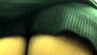 Ebony babe teasing with striptease in public bathroom