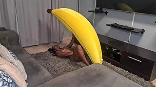Tattooed desi slut rides a big banana with close-up views of her small tits and pussy