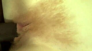 hot redhead with hairy pussy takes on a big black cock in wild action