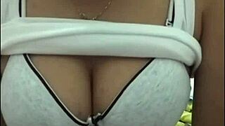 webcam babe with big tits puts on a steamy show.