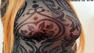 wearing sweatshirt revealing large breasts and nipples