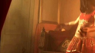 Erotic belly dancing performed by a nude brunette beauty in a teasing manner.